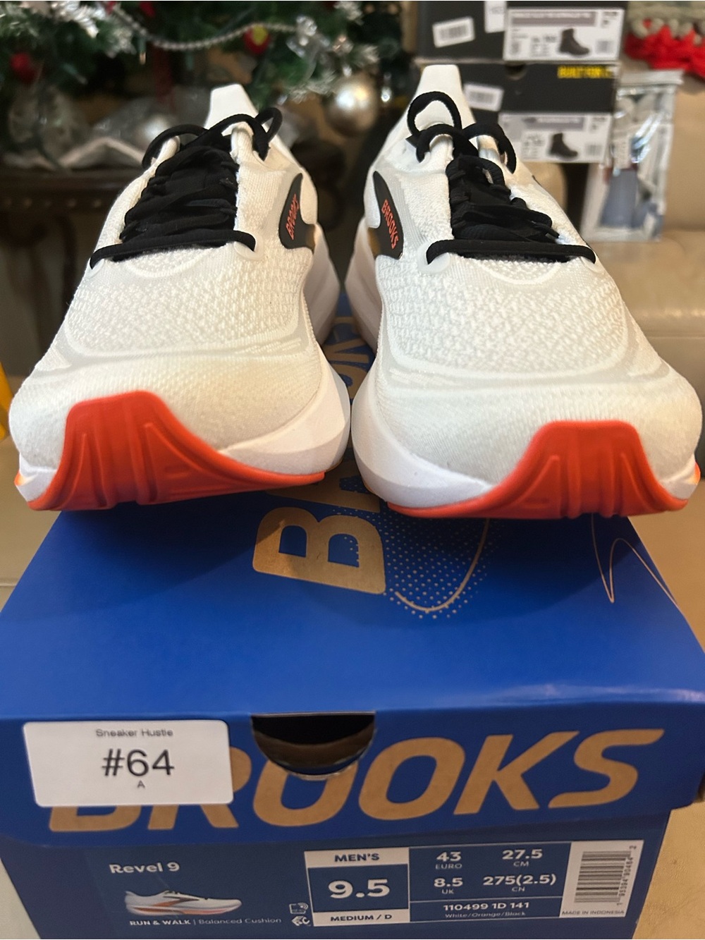 Brooks Men's White Running Shoes with Orange Accents and Black Laces